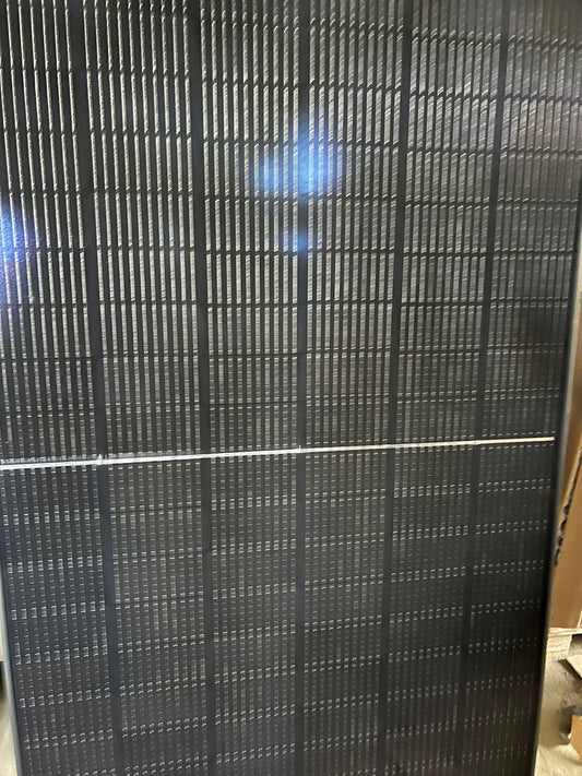 Close-up of Yingli Solar 400W Black YLM-J 3.0 Pro Series solar panel showcasing its sleek design and efficient cell layout.