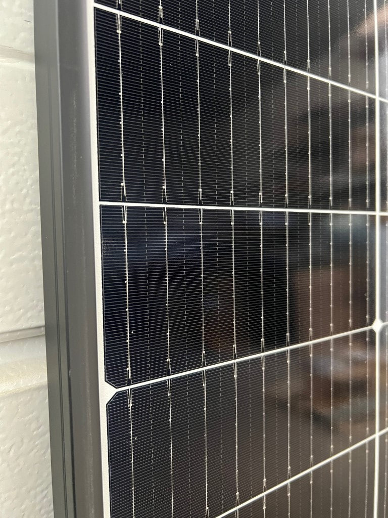 Close-up of Trina Solar double glass solar panel showcasing efficient solar cells.