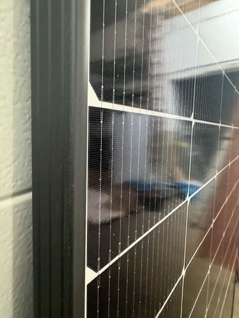 Detail view of SolarFabrik Mono S4 Trend White 445W solar module showcasing bifacial cell technology.