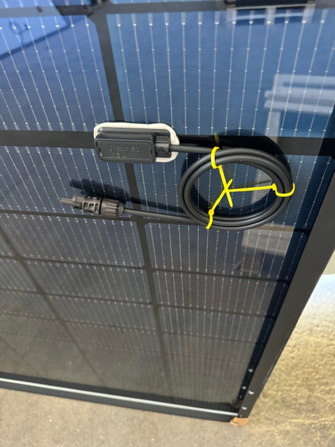 Connection port and cable on a JA Solar 440W bifacial solar panel, showcasing its design and features.